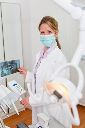 dentist-holding-xray-image-2024-06-04-19-12-33-utc-1