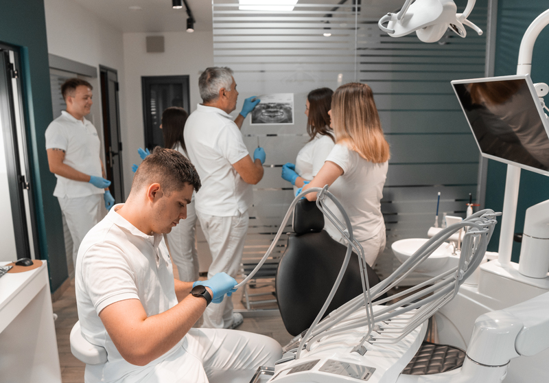dentists-work-in-dental-office-doctors-discuss-tr-2024-10-18-05-58-12-utc-1