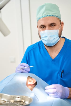 doctor-stands-at-patient-with-syringe-in-his-hands-2024-10-18-08-58-17-utc-1